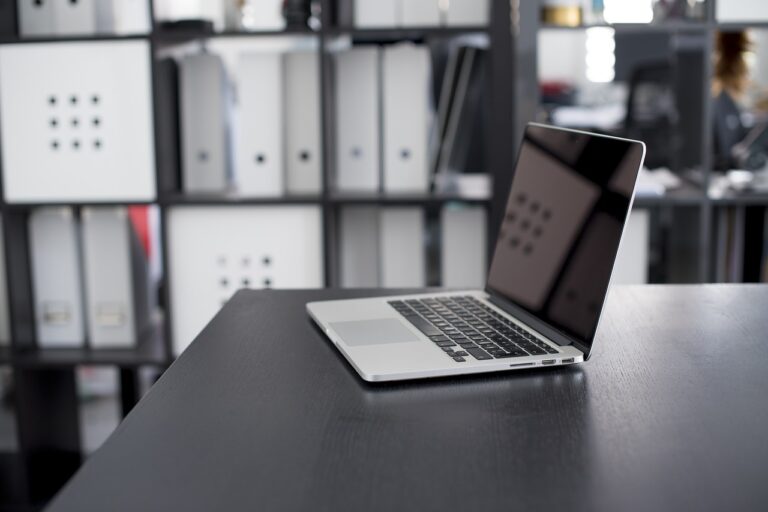 MacBook Pro 2022 is in the table near the study room.